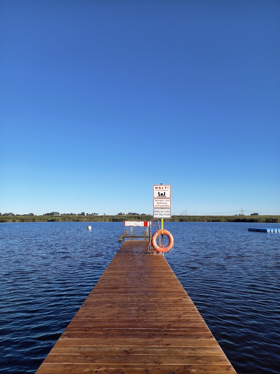 A wooden dock with a sign on it